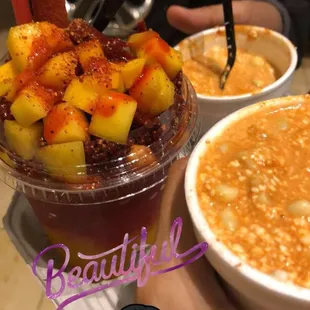 a bowl of fruit and a bowl of soup