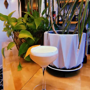 a drink in a glass on a table