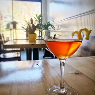 a cocktail in a glass on a table