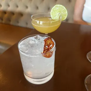 two cocktails on a table