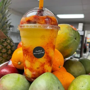 a bowl of fruit and a cup of juice