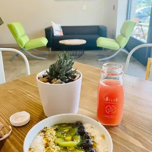 a bowl of oatmeal and a glass of juice