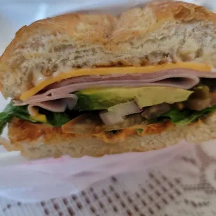 a sandwich with meat, cheese, and lettuce