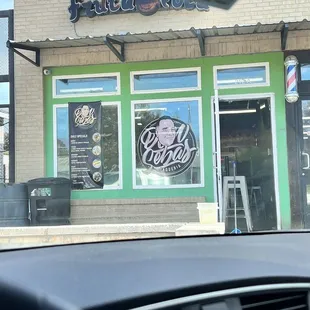 The outside of the building - the sign is no longer colorful