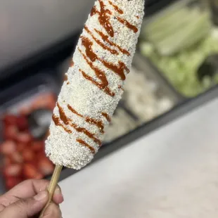 ELOTE ASADO ON A STICK!! Roasted Corn on the Cob prepared by customers choice.