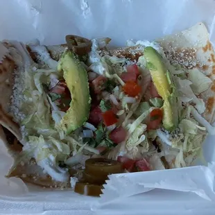 Quesadilla Supreme Asada . (Going to be messy without any utensils!?) They pile the "supreme"  on top - not inside.