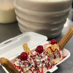 an ice cream sundae in a styrofoam container