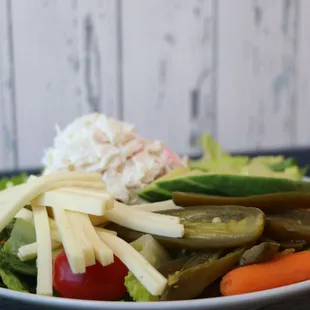 a plate of vegetables and cheese