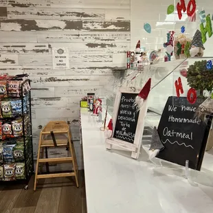 a counter with a chalkboard sign