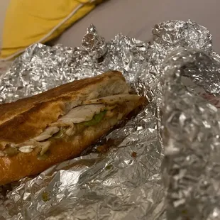  a sandwich wrapped in tin foil