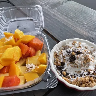 Fruit salad; mango, papaya, and pineapple. Cottage cheese, granola, coconut flakes and honey :) delicious!