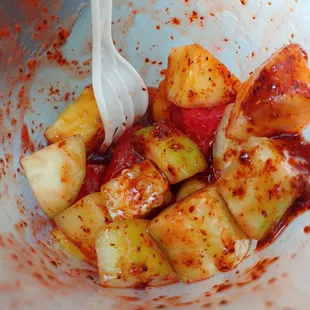 a bowl of food with a fork in it