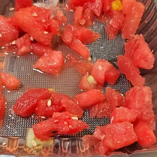 Rotten watermelon. Separated from the rest.  Smelled bad,  but the juice still got on the rest of the fruit so we didn't eat the salads.