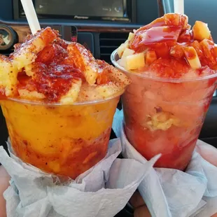 Mango freeze and guava freeze with fresh fruits, chamoy,  and tajin.
