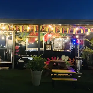 Such a cute set up and there are three other trucks next to them beside the gas station.