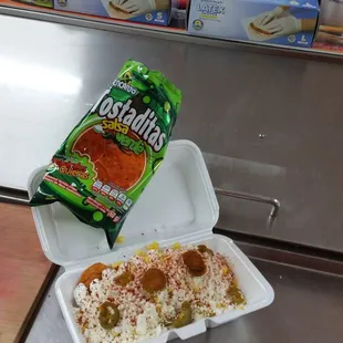 a meal in a styrofoam container