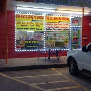 a car parked in front of a store