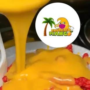 a person pouring cheese into a bowl