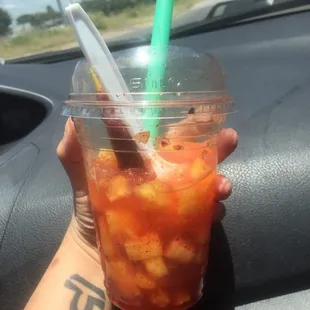 Pineapple, chamoy, chili powder, pineapple chunks and tamarind chili candy straw. Yes it's almost gone- it's that good!