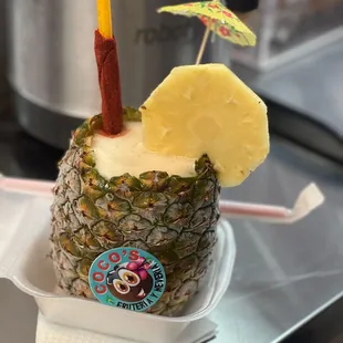 a pineapple with an umbrella