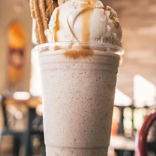 a milkshake with ice cream and pretzels
