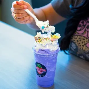 a purple drink with sprinkles