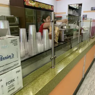 a woman behind the counter