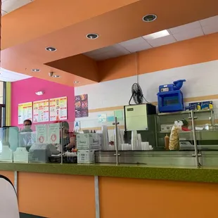 a view of a restaurant counter