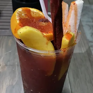 a bloody drink with orange slices