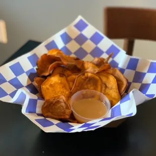a basket of chips and a drink