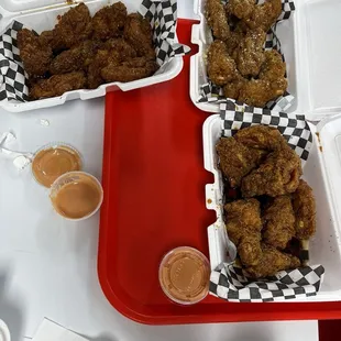 Asian Heat at the top, garlic Parmesan top right, and Finger Licking bottom right