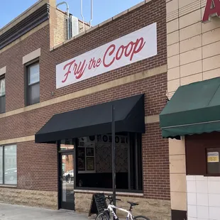 a bicycle parked in front of a restaurant