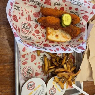 a tray of fried fish and fries