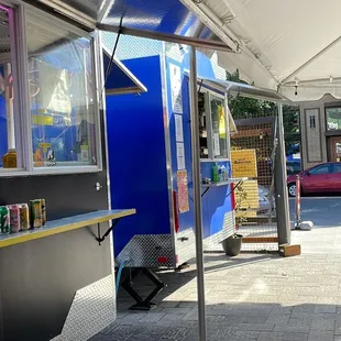 a food truck parked under a tent