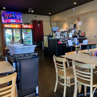 a woman sitting at a table in a restaurant