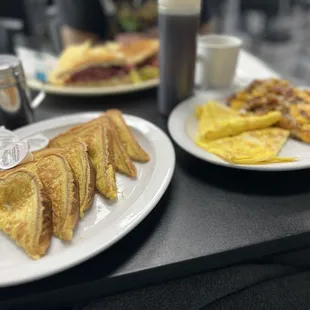 two plates of breakfast food
