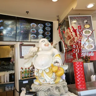 a statue of a laughing buddha