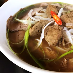 P1. Pho-Licious, beef &amp; chicken bone broth combined, with homemade meatball slices, thin beef slices, &amp; brisket slices.