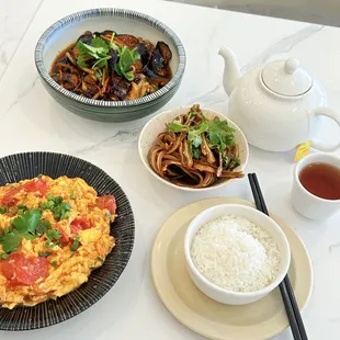 a plate of food and a bowl of rice