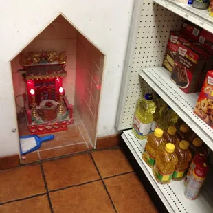 Shrine next to the cooking oil.