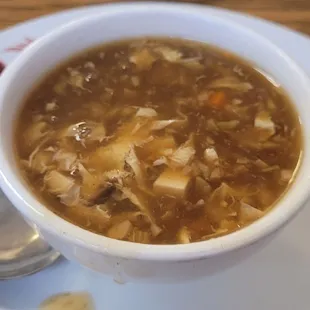 Hot and Sour soup with chunks of carrots..