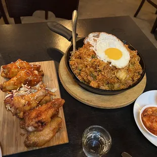 a plate of fried eggs and other dishes on a table