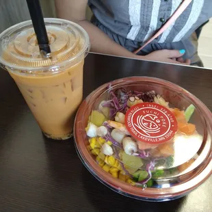 a salad and a drink on a table