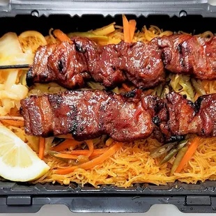 Two pork BBQ with pansit, $12.50. BBQ has a slightly smokey favor.