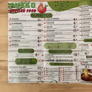 a menu on a wooden table