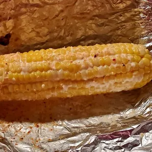 Elote - to go, melted, looked pretty when they made it!