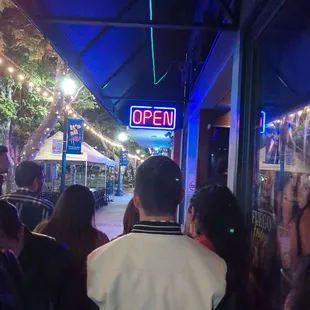 This is the line, they are wasting time on purpose. They advertised free entry if you got here before eleven. We have waited for one hour.