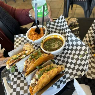 a plate of tacos and a bowl of salsa