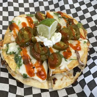 a close up of a flatbread pizza