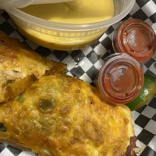 Burrito with cheese on side